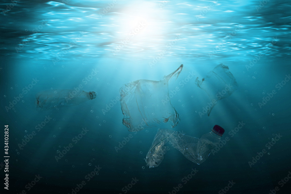 Pollution of ocean with plastic waste floating in the water. Environmental protection and ecology concept. 