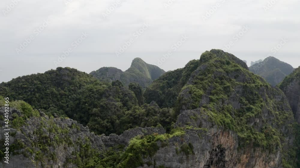 drone shot flying through the mountains of tropical island drone shot flying through the mountains of tropical island