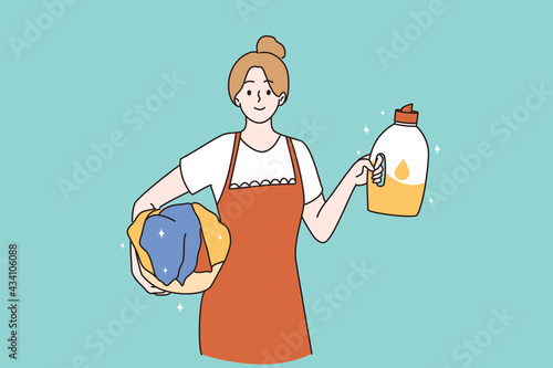 Housemaid and housewife concept. Portrait of smiling positive woman cartoon character working as housemaid holding in hands chemical softener laundry vector illustration 