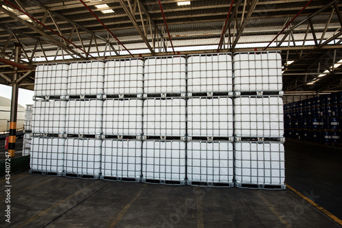 Chemistry white tank on pallets are storage in the warehouse factory photo