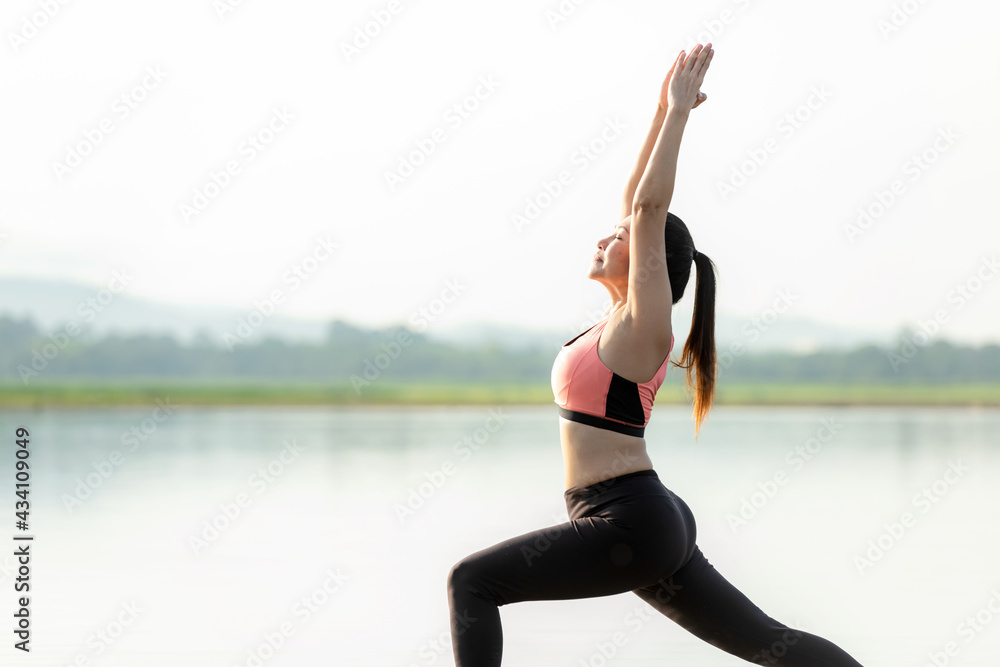 Foto Stock Yoga women lifestyle exercise and pose for healthy life. Young  girl or people pose balance body vital zen and meditation for workout  sunrise morning nature background. Health care Concept