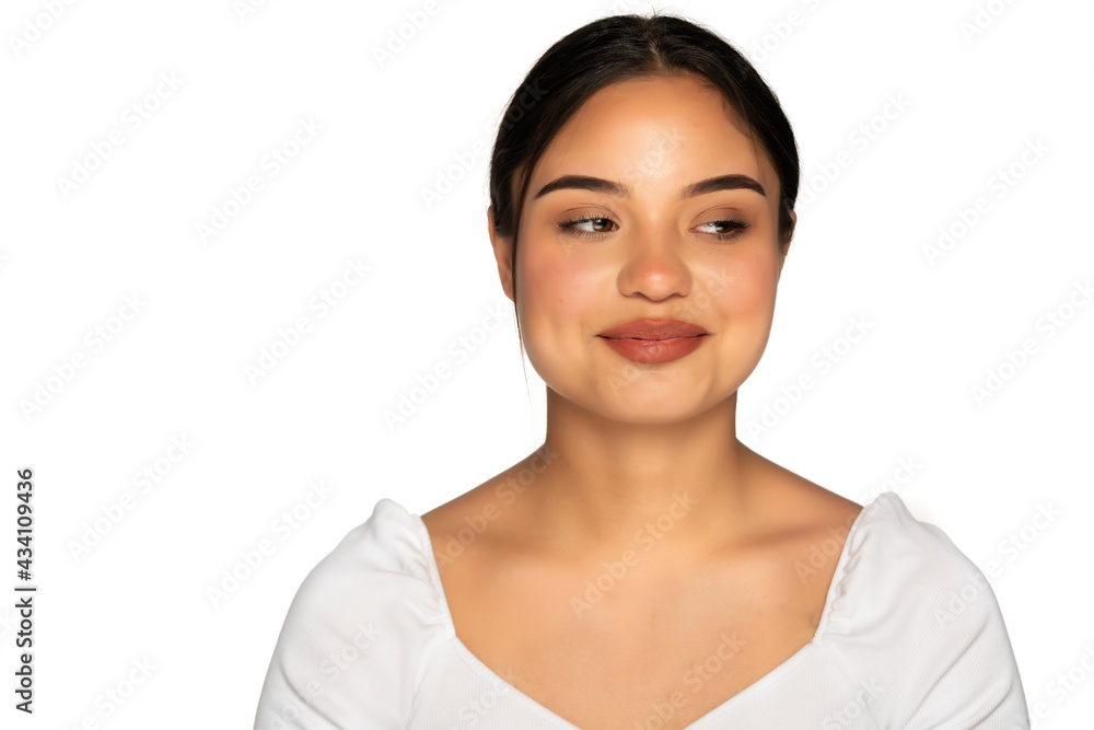 a young smiling woman without makeup looks away a young smiling woman without makeup looks away