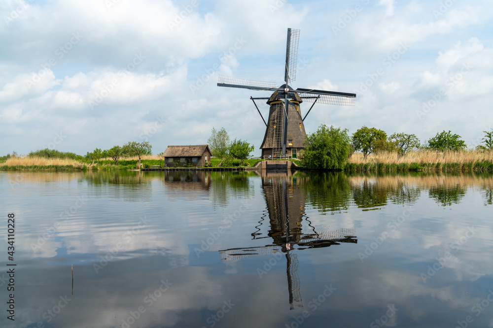 view of a historic 18-century windmill at Kinderdijk in South Holland