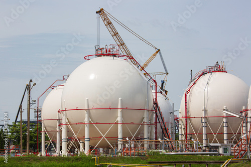 White spherical propane tanks containing fuel gas pipeline