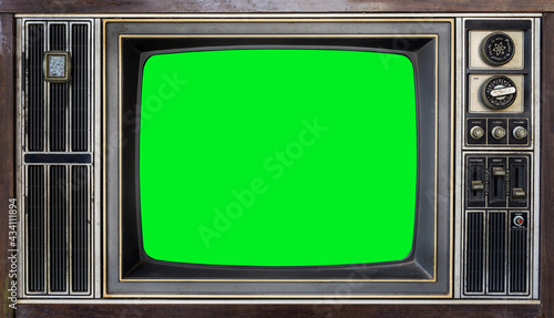 Close up of old retro TV with blank green screen for a designer, stylish mockup