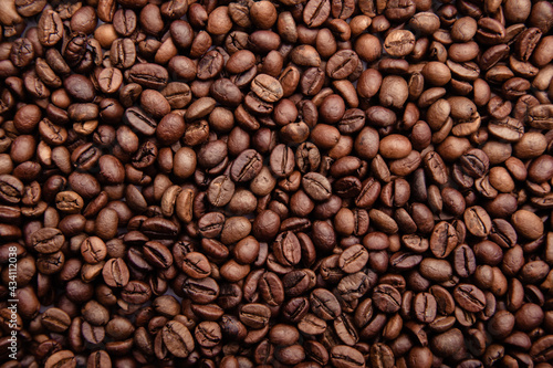 Freshly roasted coffee beans background close-up