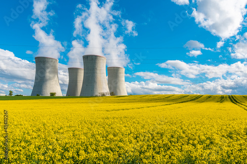 Cooling towers of a nuclear power plant in beautiful summer landscape. Nuclear power station Dukovany. photo