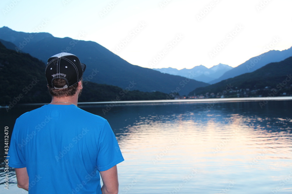 person on the lake watching the sunset