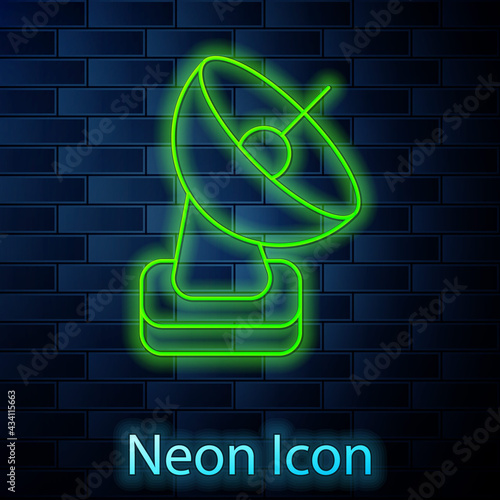 Glowing neon line Radar icon isolated on brick wall background. Search system. Satellite sign. Vector