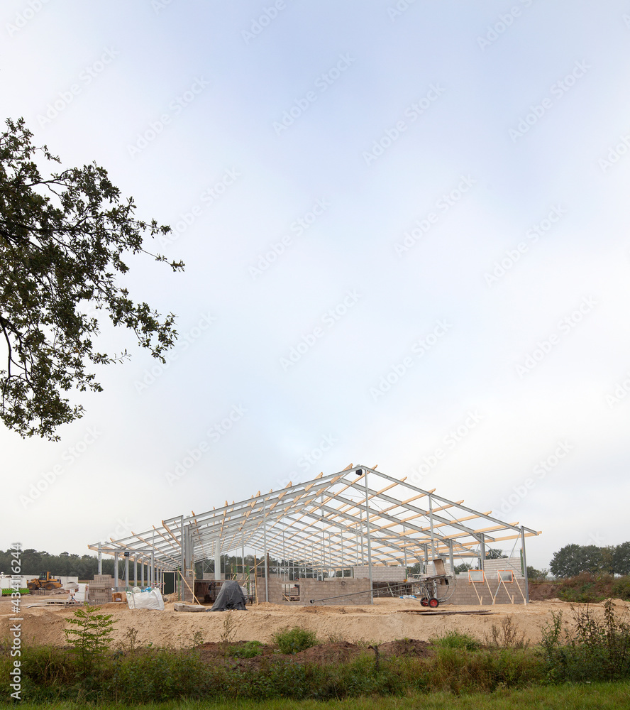 Building a new cattle stable. Construction site. Framework. Farming. Netherlands.