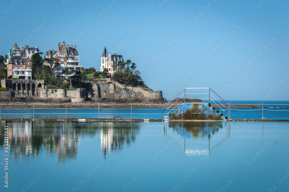 Perfect reflection photography in french westcoast, natural swimming pool with sky and ocean