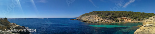 seacoast of the beach in mallorca with beaturiful view of the sea with crystalclear water. Sea view of turquoise colour. Concept of summer, travel, relax and enjoy