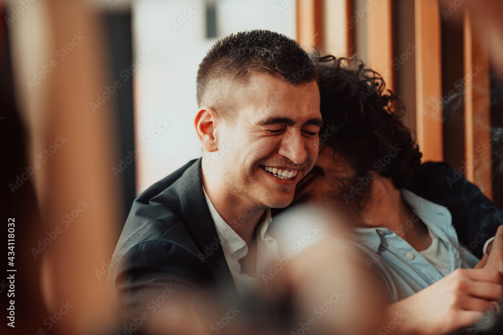 Diverse friends gay couple hugging. Stylish cool generation z men dating in love enjoy romantic relationships Diverse friends gay couple hugging. Stylish cool generation z men dating in love enjoy romantic relationships