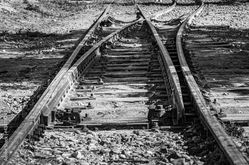 Grayscale closeup shot of train tracks in Rivas-Vaciamadrid, Spain photo
