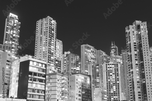 high rise residential building in Hong Kong city at night © leeyiutung