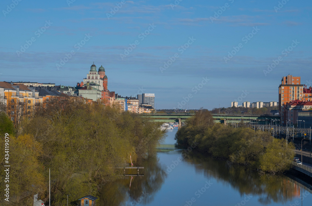 The canal Karlbergs kanalen in Stockholm with residential and office buildings a sunny spring morning