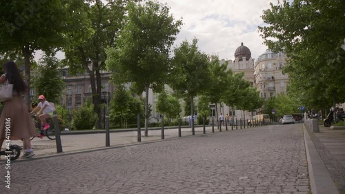 Wallpaper Mural Pretty young woman riding an electric scooter on a street Torontodigital.ca