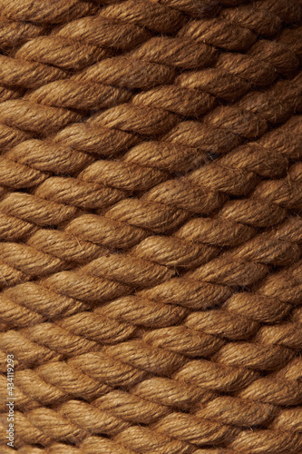 Closeup rope background. Low light brown rope texture. Vertical gradient pattern.