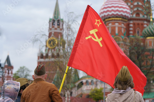 Flag of the Soviet Union blowing over the street. Moscow in the spring during Victory Day celebration