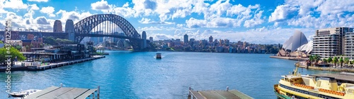panorama View if Sydney Harbour Picture taken from Cahill Expressway Circular Quay NSW Australia. Ferry boats partly cloudy skies