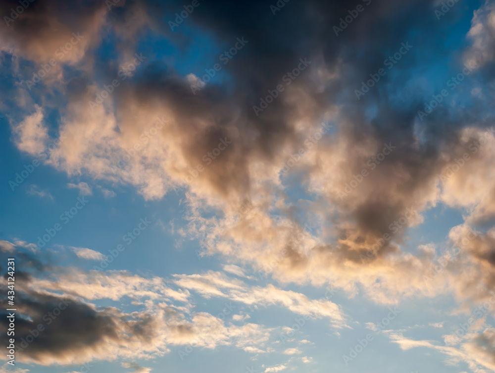 Layered Clouds in Evening Light of Sunset on Blue Sky Background - Overcast Western Sky in Spring Dusk Time - Belarus Minsk