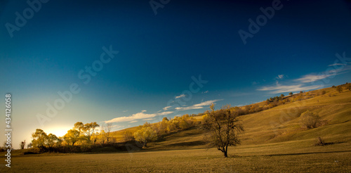 Gently rolling hills in the early morning in autumn in Transylvania.
