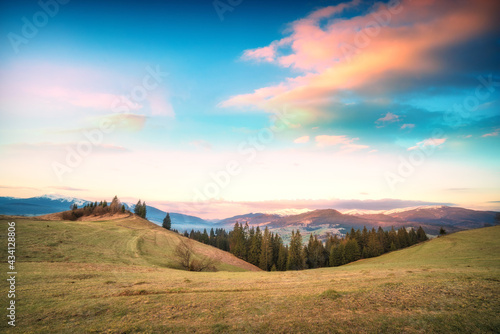 Colorful clouds over the carpathian alpine valley