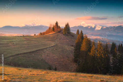 Distant snovy mountains in a carpathian alpine valley