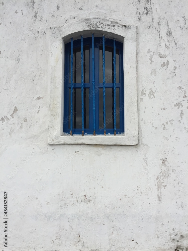 Old Blue Window in the White Wall Old Blue Window in the White Wall