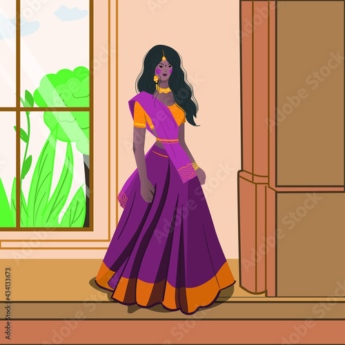 A beautiful Indian woman is standing, ear rings, bangles, long hair, traditional clothes.