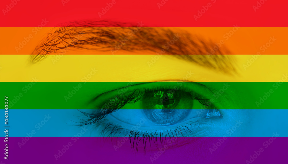 Obraz premium Close up of eyes with LGBT Pride Rainbow flag isolated