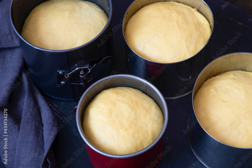 Easter cake dough in a metal pan. Preparation before baking Easter cake Easter cake dough in a metal pan. Preparation before baking Easter cake