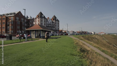 Hotels, Whitby Beach and colourful beach huts from West Cliff, Whitby, North Yorkshire, England, United Kingdom, Europe photo