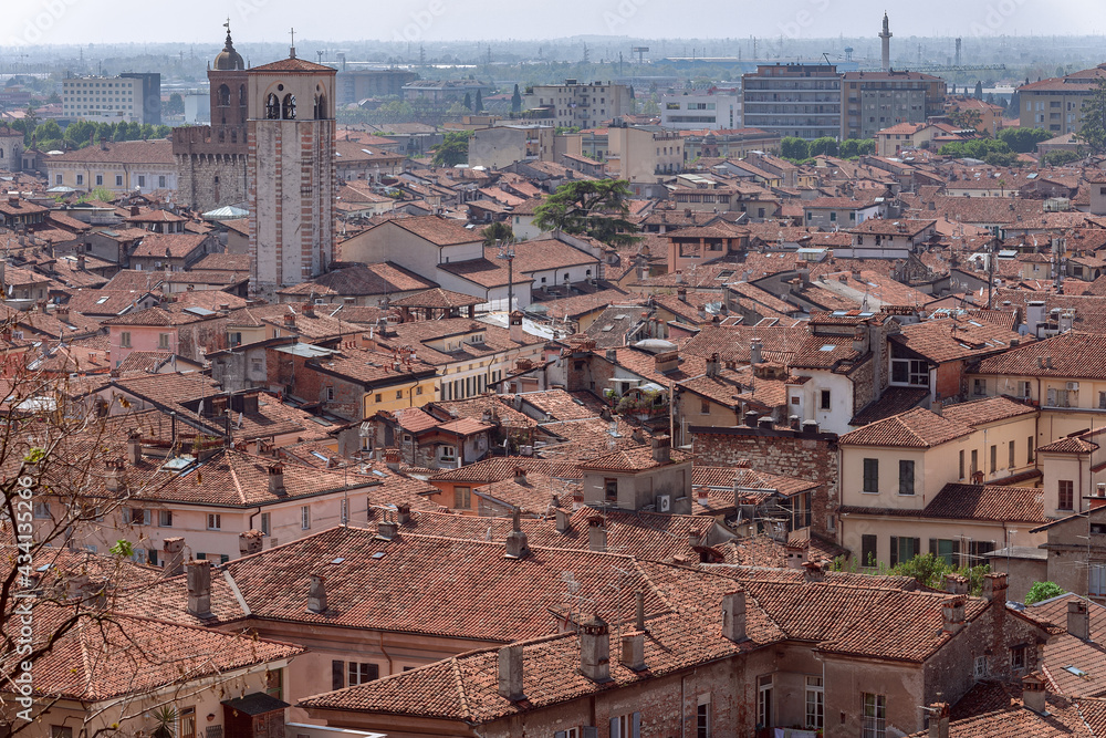 Obraz premium View of the tiled roofs of ancient houses in the center of Brescia (Lombardy, Italy)