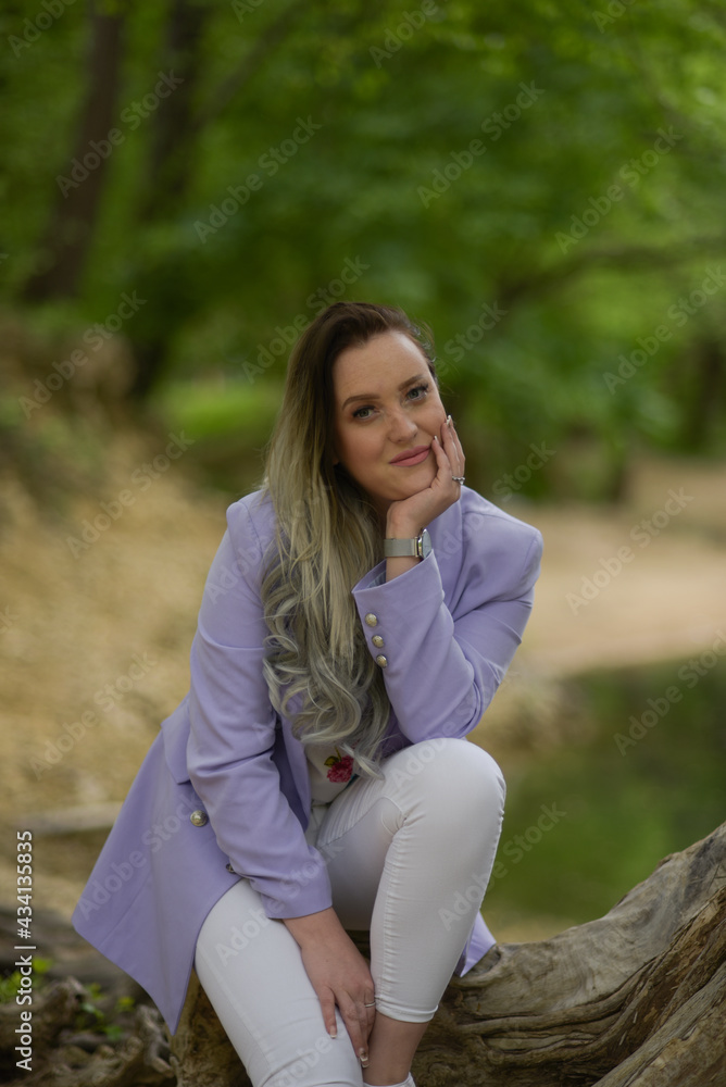 Beautiful young teen women in nature. Woman breathing fresh air in a green forest in summer Beautiful young teen women in nature. Woman breathing fresh air in a green forest in summer