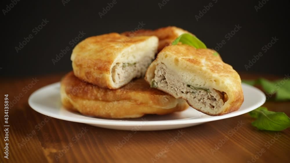 fried pies with meat in a plate on a white fried pies with meat in a plate on a white