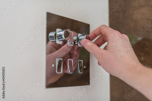 Tableau sur toile Modern dimmer light switch used being lowered for dimmer lighting and to save el