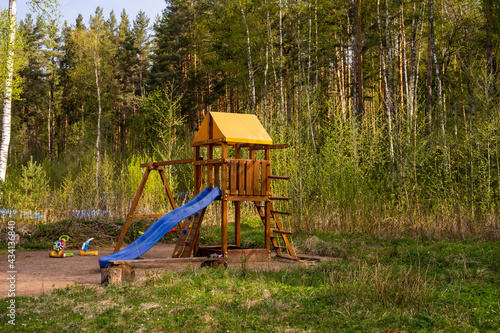 Summer kids playground in the forest. Outdors training and play