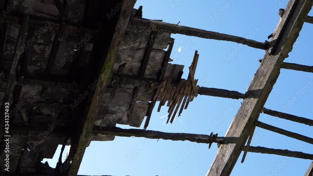 Roof rafters of derelict building after fire Roof rafters of derelict building after fire