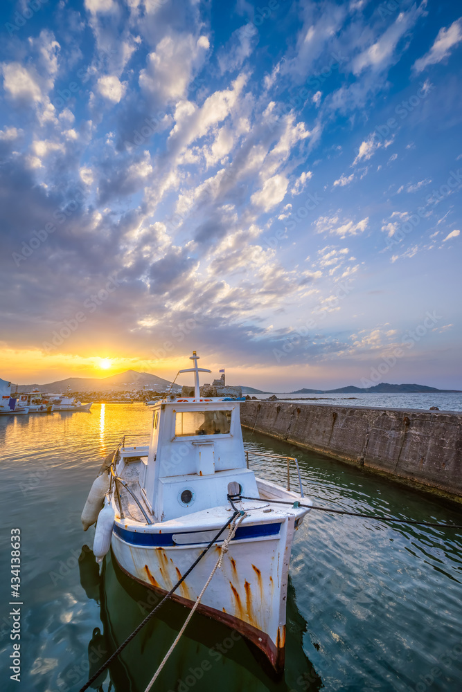 Fishing boat in port of Naousa on sunset. Paros lsland, Greece