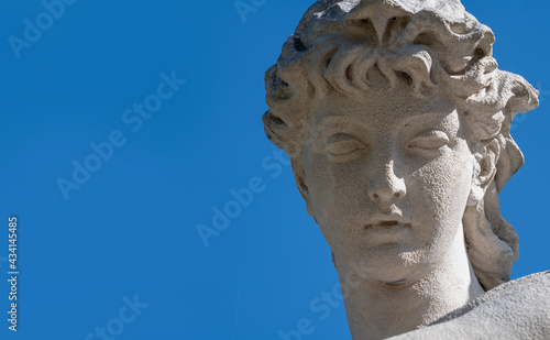 The goddess of love in Greek mythology, Aphrodite (Venus in Roman mythology) Close up fragment of an ancient statue. Horisontal image.