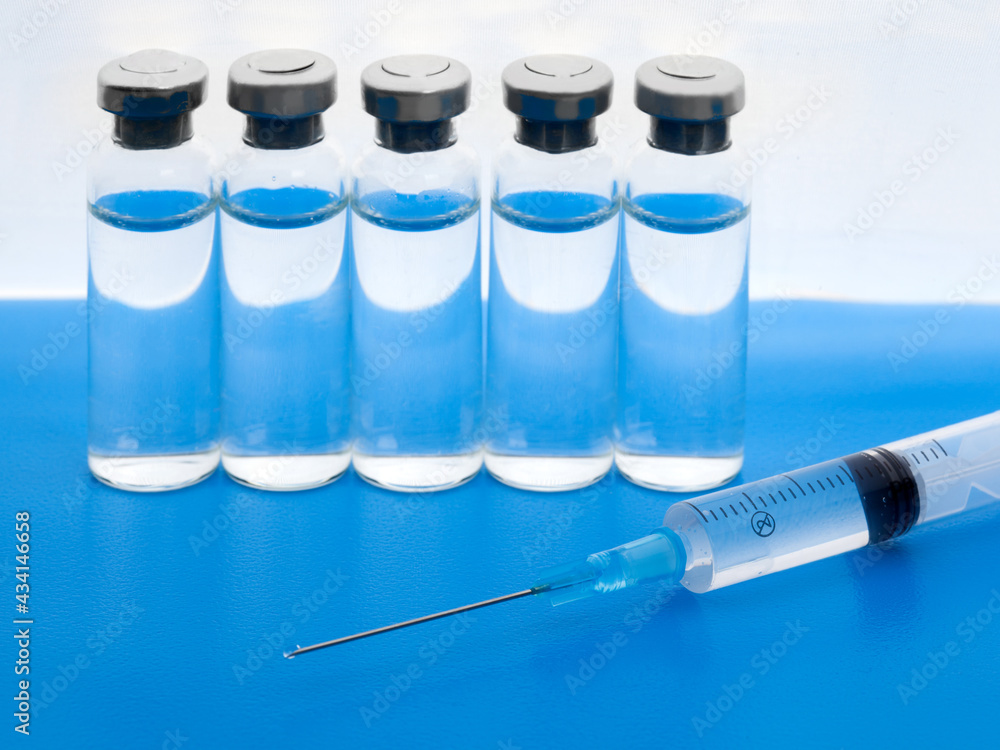 Close-up medical syringe and vials with medicine for injection Close-up medical syringe and vials with medicine for injection