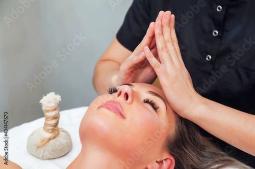 Asian masseur do makes head massage woman with facial and treatment