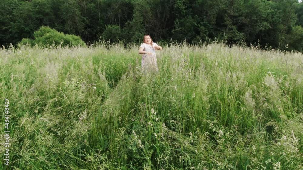Green meadow with tall grass in middle of forest. Green meadow with tall grass in middle of forest.