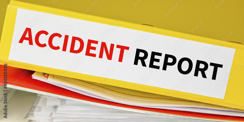 Text ACCIDENT REPORT on a folder.Business and financial concept.