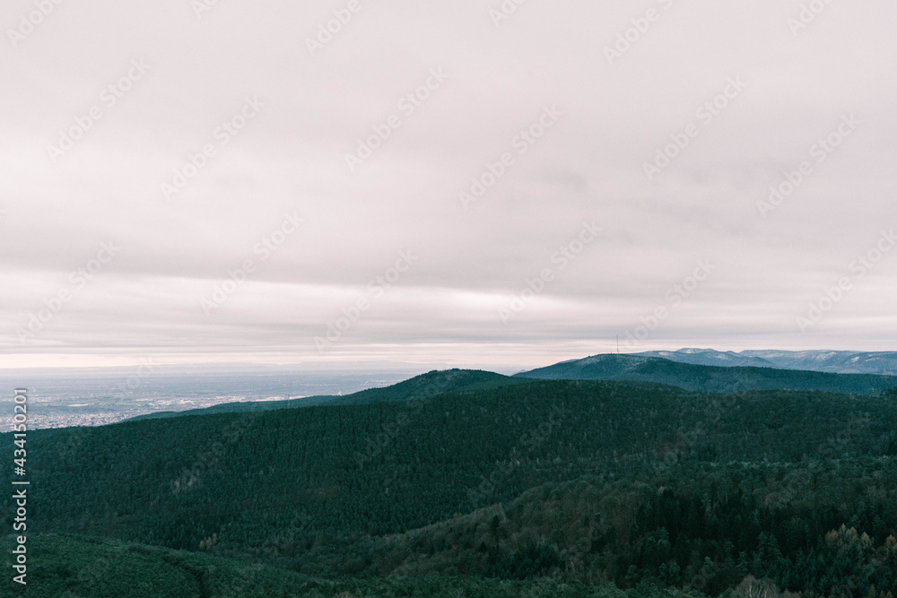 clouds over the mountains in the palatinate forest