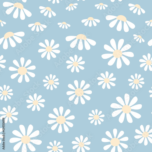 Seamless pattern of daisies in blue background. It can be used for wallpapers, cards, wrapping, patterns for clothes and other.