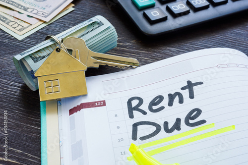 Rent due sign in the planner and key. photo