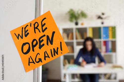 We are open again sign about reopening after quarantine.