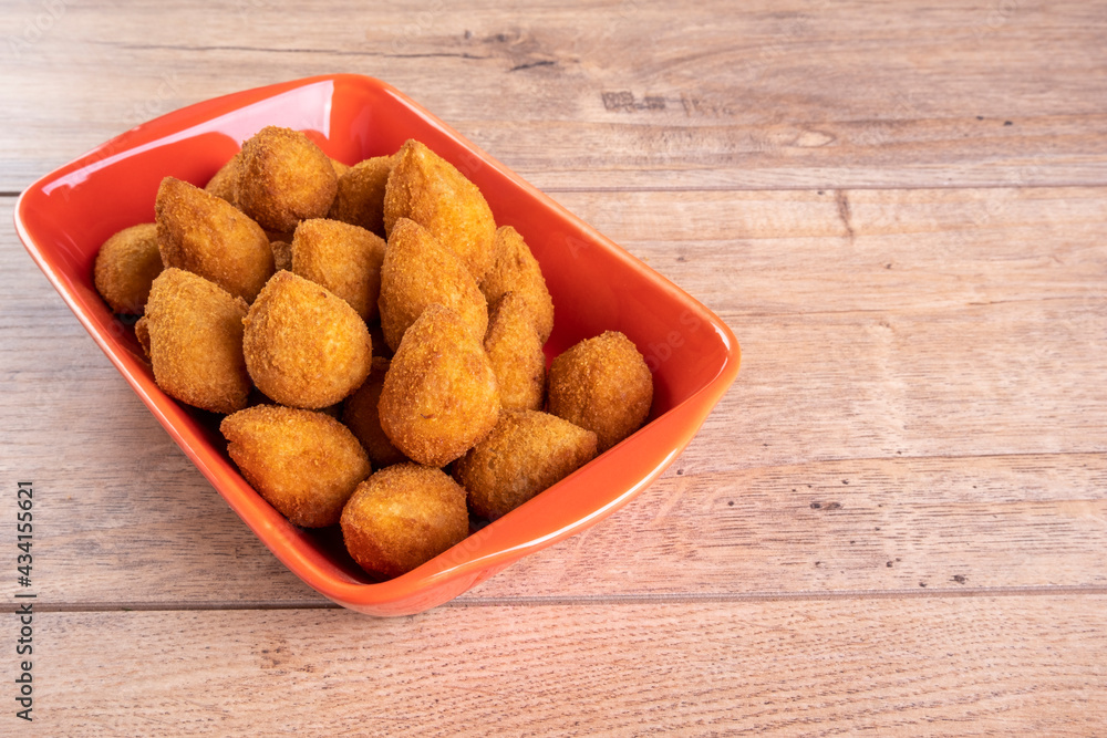 Traditional Brazilian fried snack stuffed with chicken . Coxinha de frango Traditional Brazilian fried snack stuffed with chicken . Coxinha de frango